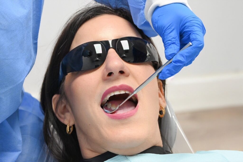 Patient receiving a dental implant procedure at West Brickell Dental in Miami.