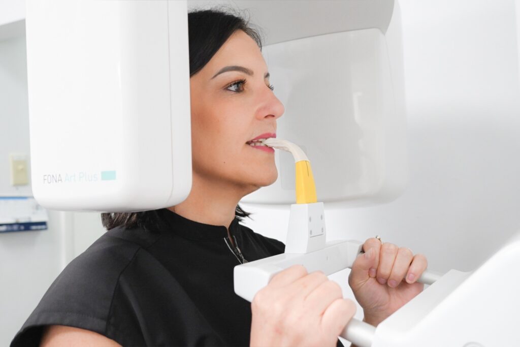 Patient receiving a dental implant procedure at West Brickell Dental in Miami.